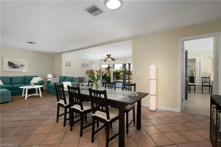Dining room featuring tile patterned flooring and ceiling fan