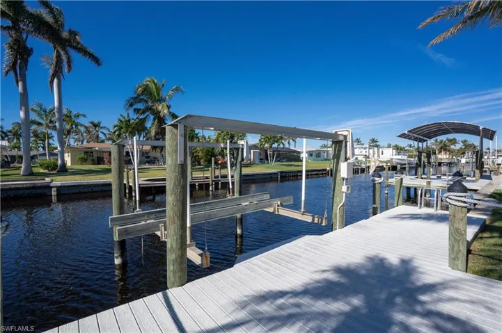 Dock area featuring a water view