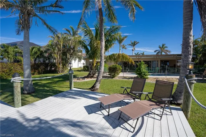 Wooden terrace with a lawn