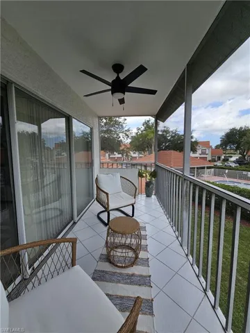 Balcony featuring ceiling fan