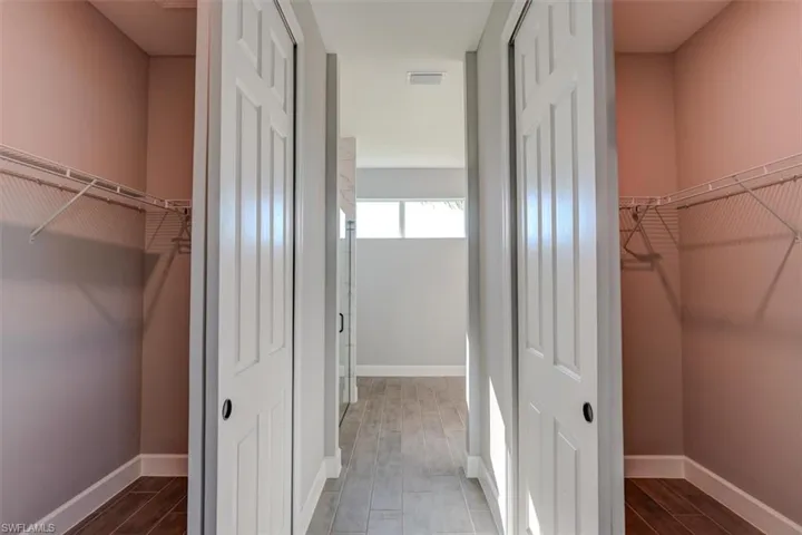 Spacious closet featuring hardwood / wood-style floors