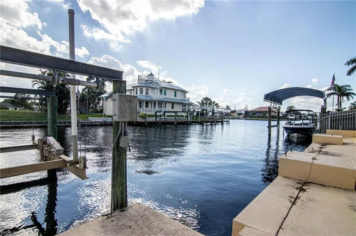 Dock area featuring a water view and boat lift