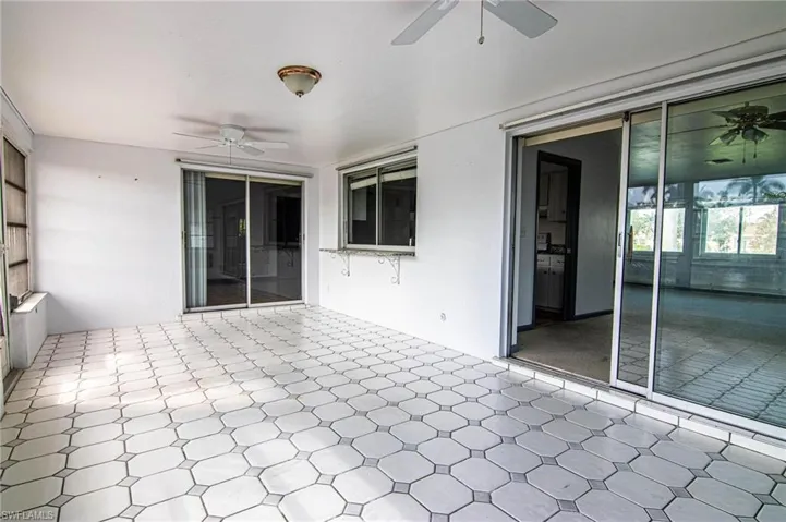 View of patio featuring ceiling fan