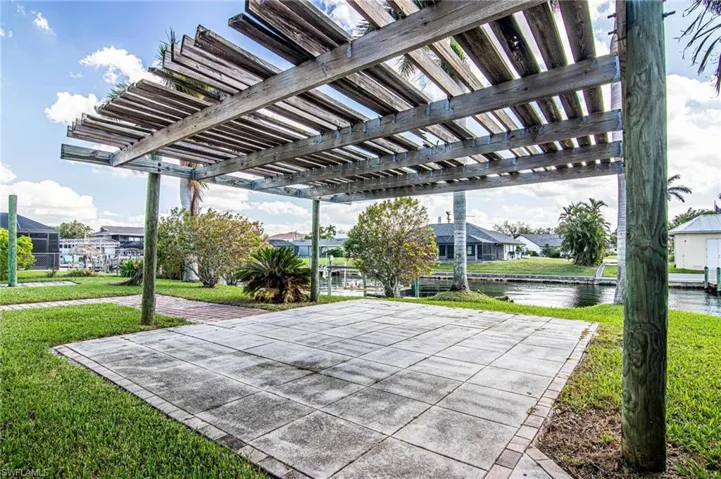 View of patio featuring a residential view, a water view, and a pergola