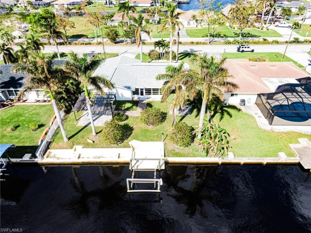 Aerial perspective of suburban area with a nearby body of water