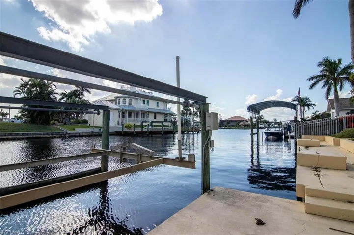 Dock featuring a water view and boat lift