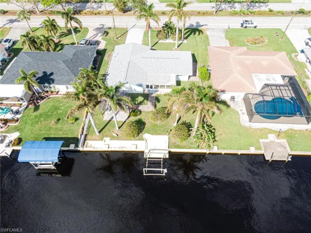 Aerial perspective of suburban area with a pool area