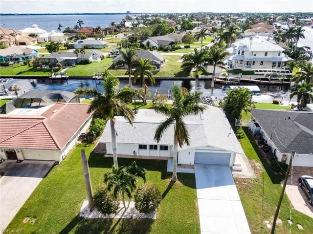 Aerial view of residential area with a nearby body of water
