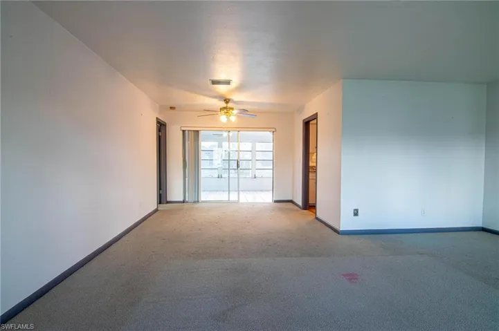 Spare room with carpet floors and ceiling fan