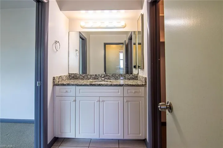 Bathroom with vanity and light tile patterned floors