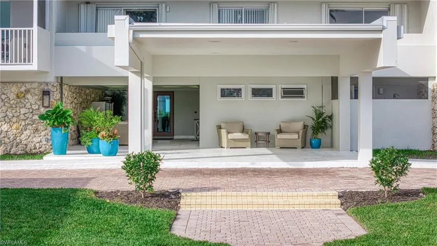 Doorway to property with a patio area
