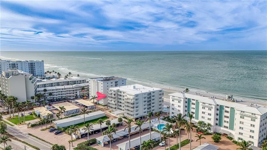 Aerial view with a water view and a view of the beach