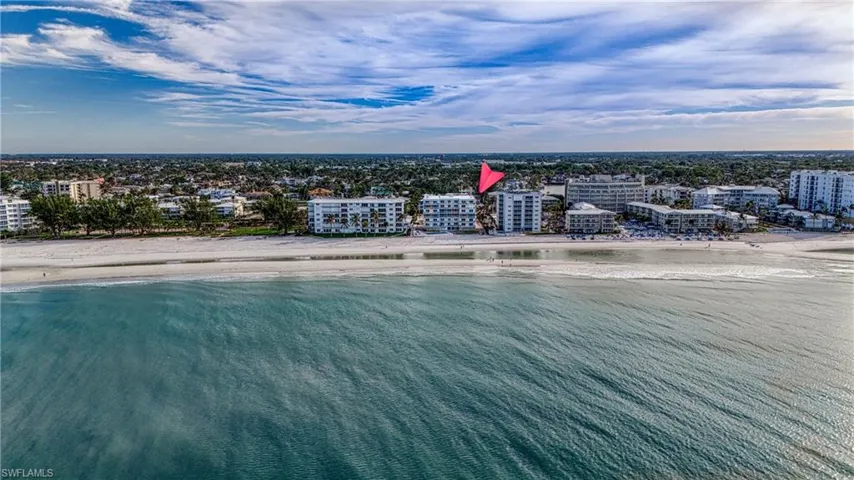 Aerial view featuring a view of the beach and a water view