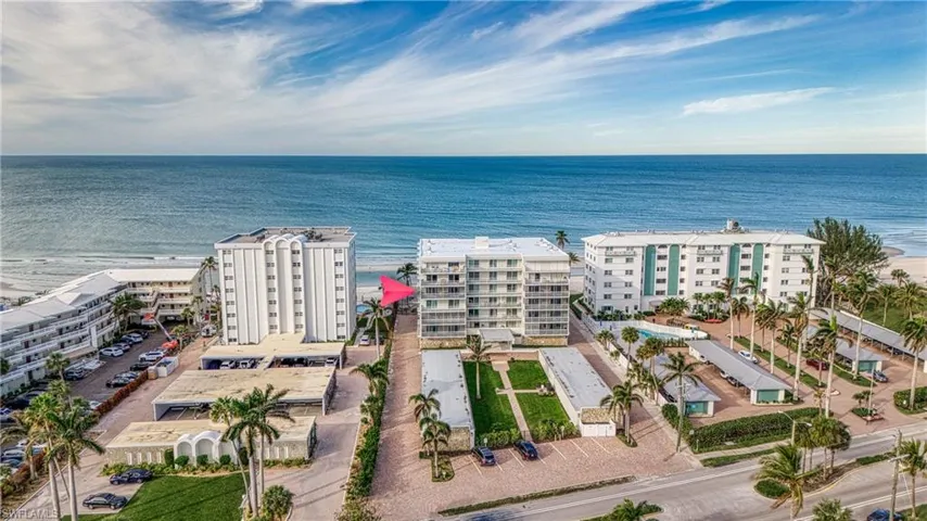 Birds eye view of property with a water view