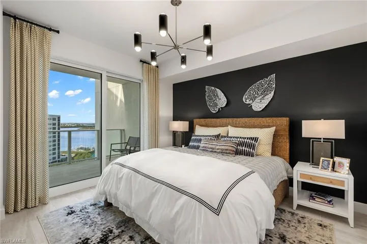Bedroom 1 features a stunning black statement wall, with contemporary decor