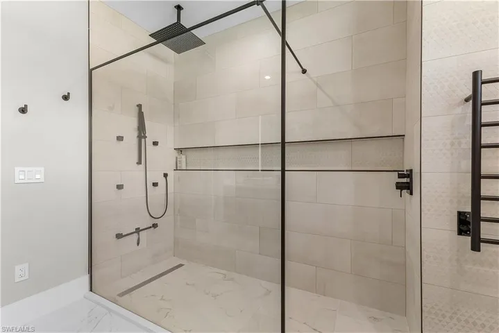 Bathroom featuring a tile shower