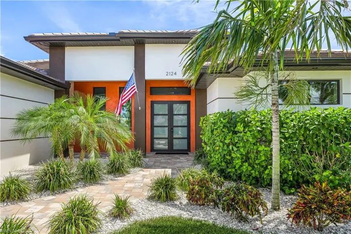 View of exterior entry featuring french doors
