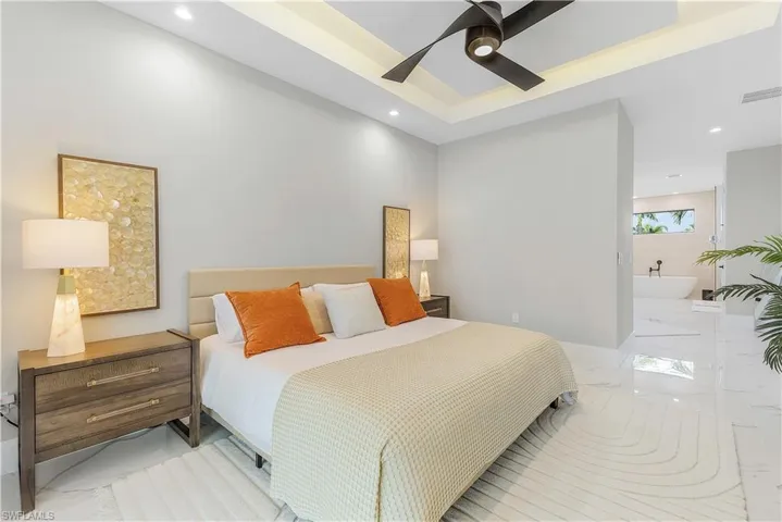 Tiled bedroom with ceiling fan