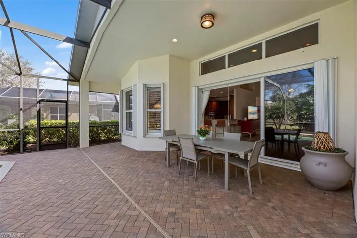 Notice accordion storm shutters on back windows and sliders