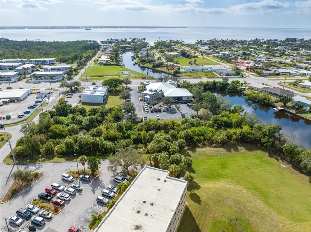 Aerial view of property's location featuring a nearby body of water