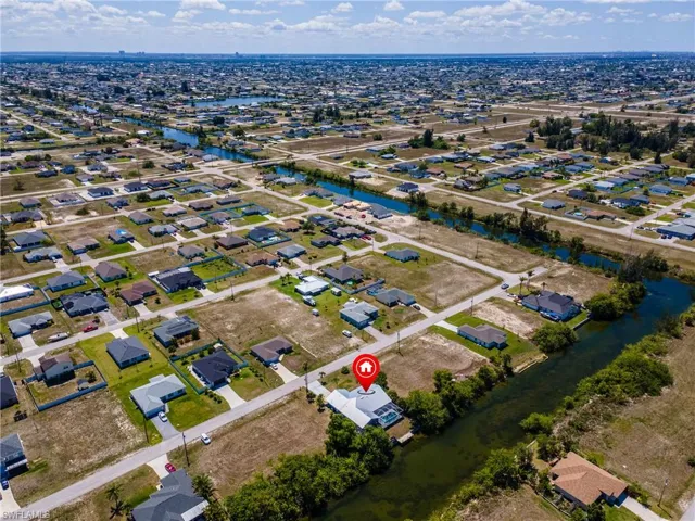 Aerial overview of property's location featuring nearby suburban area