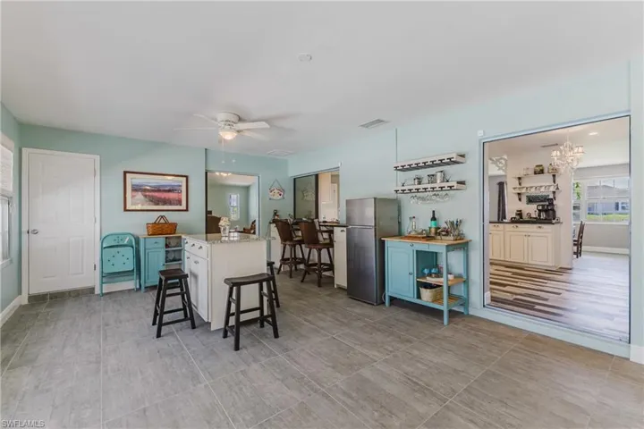 Dining area featuring ceiling fan and a chandelier