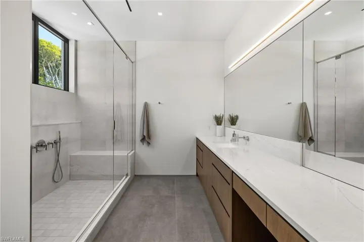 Bathroom with vanity and an enclosed shower