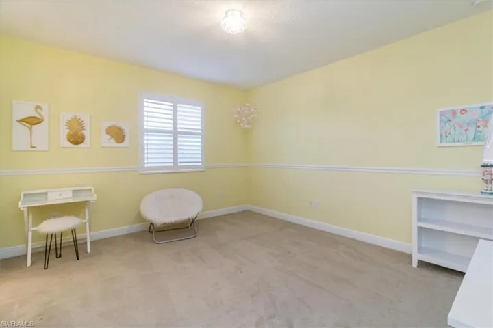 Living area with light colored carpet