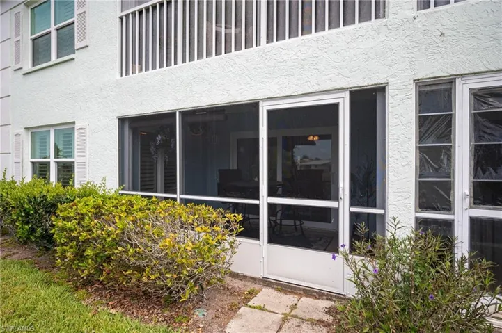 Ground-level screened patio with concrete slab flooring