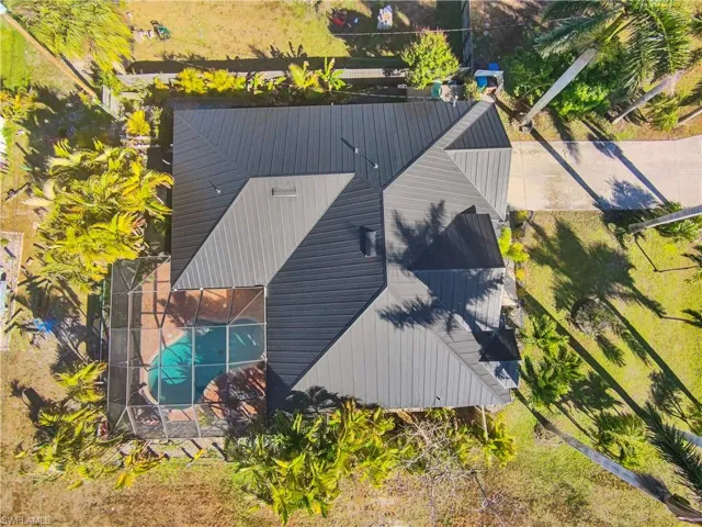 View of subject property with a pool area