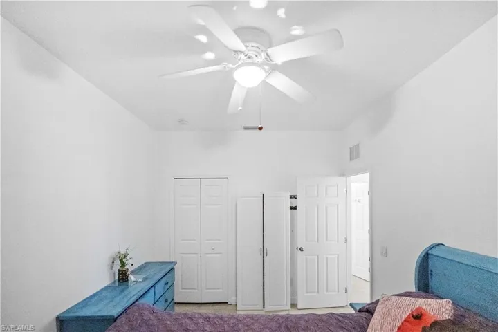 Bedroom featuring a closet and ceiling fan