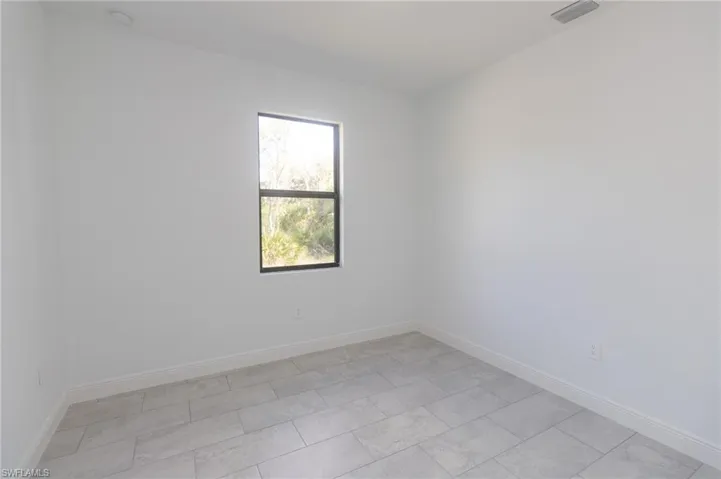 Bedroom featuring tile floors.