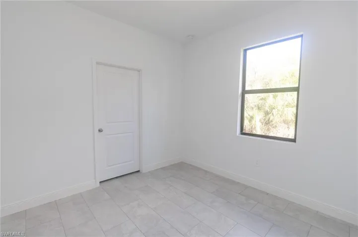 Bedroom featuring tile floors.