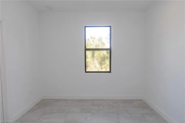 Bedroom featuring tile floors.