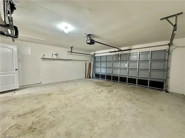 View of Two Car Garage with a new Water Heater.