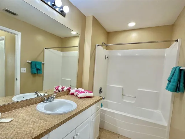 Primary Mirrored Vanity with Combo Tub/Shower