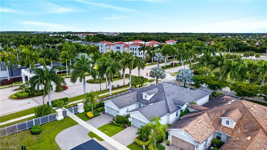 Aerial perspective showcasing residential properties with tile roofing and manicured landscaping