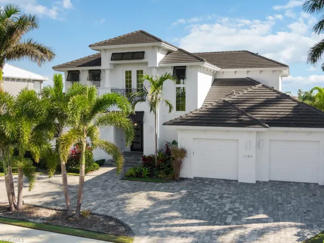 Mediterranean / spanish house featuring a garage