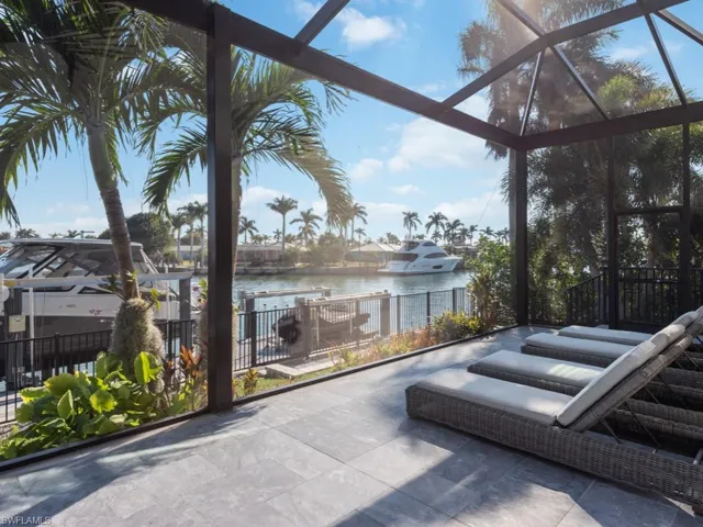 View of patio / terrace with a water view and a lanai