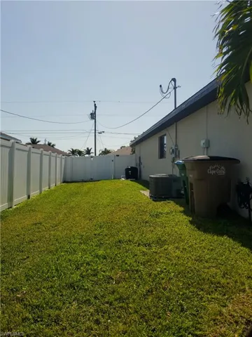 Left side yard with gate to back yard