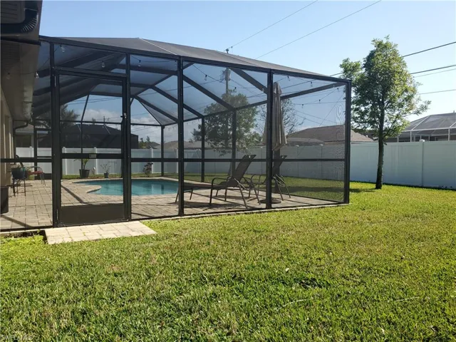 Screen enclosure and back yard