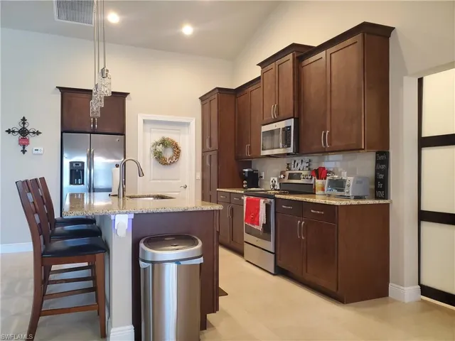 Kitchen leading to laundry room and guest area