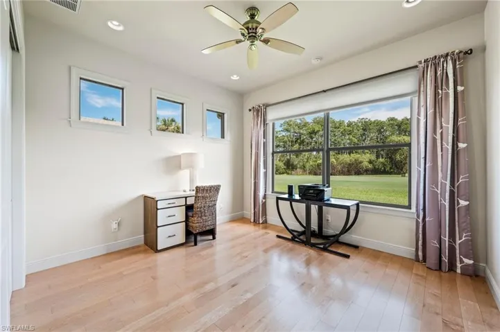 Another guest bedroom currently used as an office with views to lawn and course