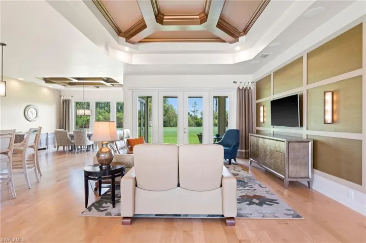 Open Great Room with soaring coffered tray ceilings.