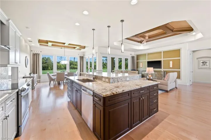 Open floor plan with incredible custom kitchen with island. Granite counters & stainless appliances.