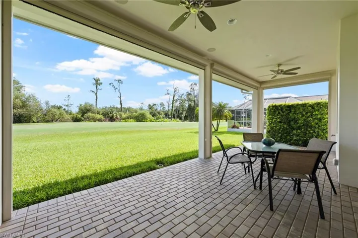 Paver brick lanai with roll down screens. Plenty of room for a pool.