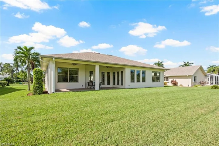 Rear view of home and lawn.