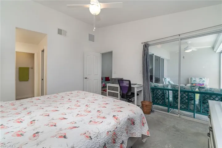 Primary Bedroom with slider doors to the lanai