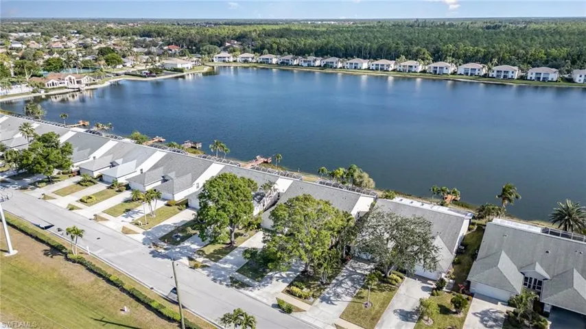 View of the home looking towards the clubhouse, community pool and tennis courts
