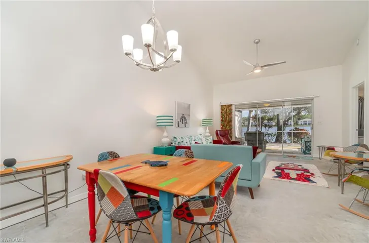Dining room with chandelier and vaulted ceiling